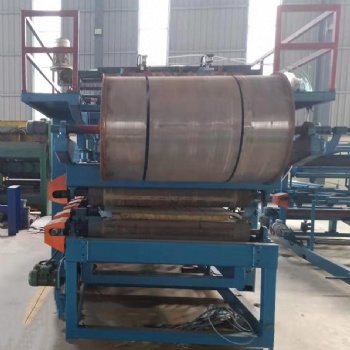 興和壓瓦機全自動970-950兩用巖棉泡沫夾芯泡沫復(fù)合板生產(chǎn)設(shè)備